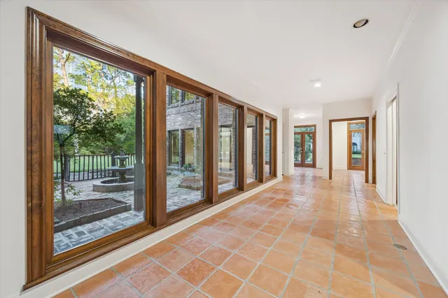 a view of hallway with a large window and stairs