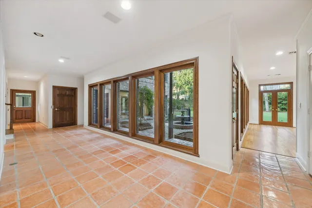 a view of an empty room with glass door
