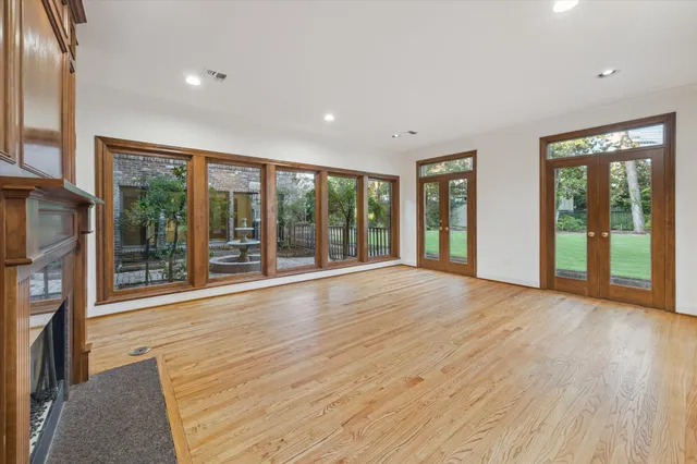 a view of an entryway with wooden floor