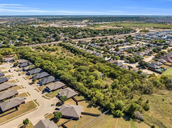 an aerial view of residential building and an ocean