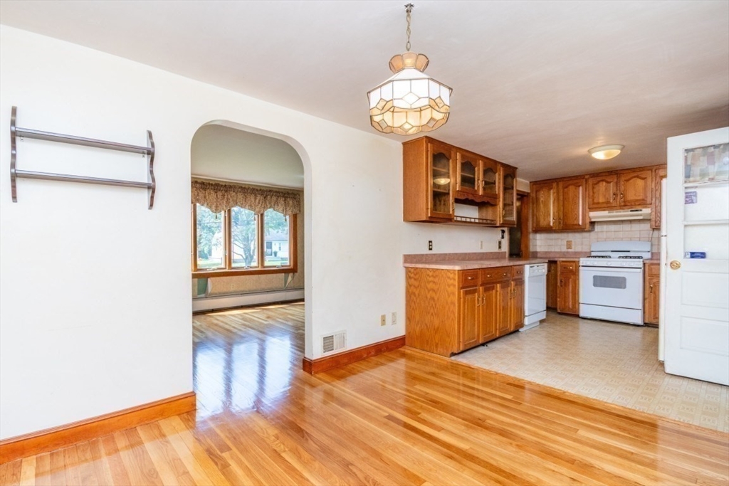 5 Edward Street Canton, MA 02021 - Photo 14 of 24 a kitchen with stainless steel appliances granite countertop a stove and a refrigerator