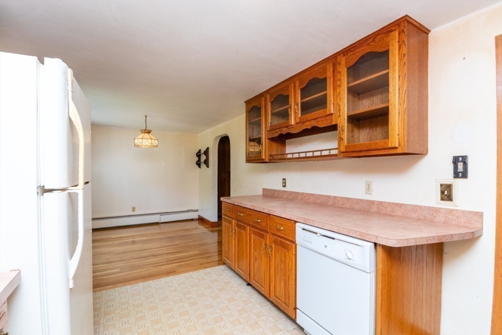 5 Edward Street Canton, MA 02021 - Photo 10 of 24 a kitchen that has a lot of cabinets in it
