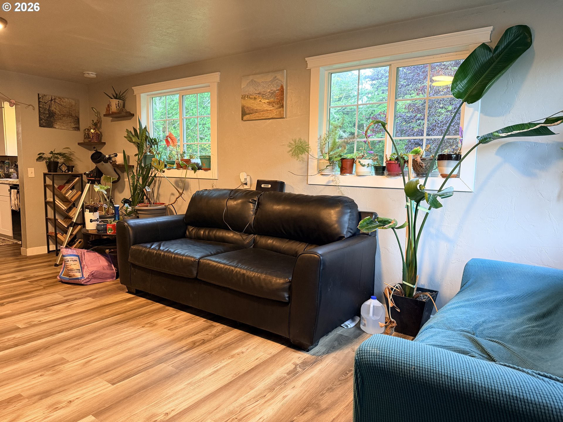 677 Southeast Moffitt Road Waldport, OR 97394 - Photo 10 of 36 a living room with furniture and a large window