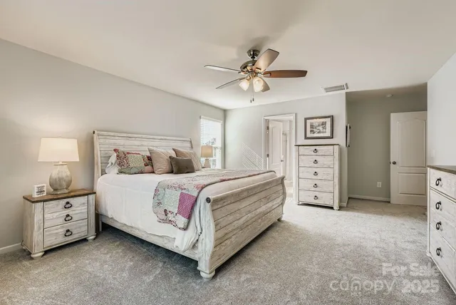 a bedroom with a bed and a cabinets