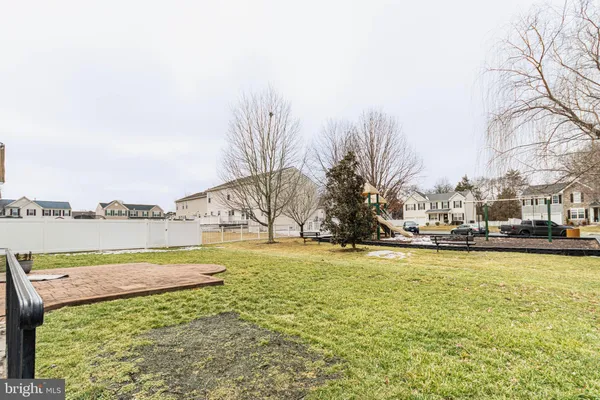 a view of a lake with houses in the back