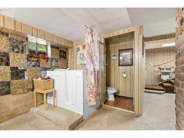 a view of a livingroom with furniture and a window