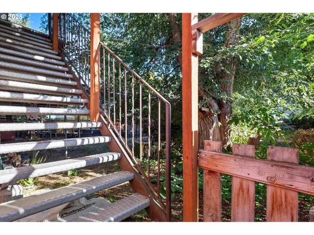 a view of a balcony with wooden floor