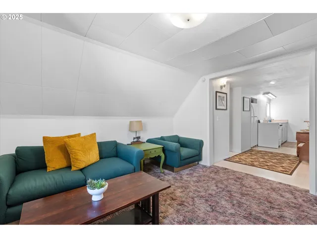 a bedroom with furniture and a wooden floor