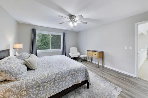 a bedroom with a bed and window