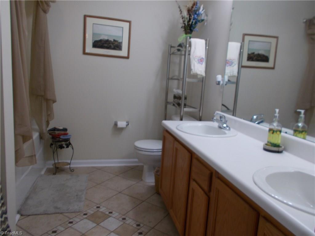 2790 WaterStone Loop High Point, NC 27265 - Photo 13 of 24 The Master Bath has a double bowl Vanity and Tile Floors