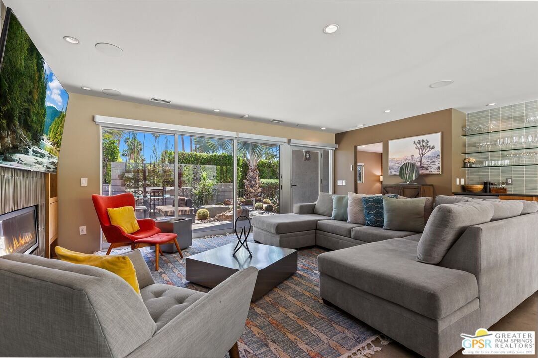 1349 Sagebrush Road Palm Springs, CA 92264 - Photo 12 of 61 a living room with furniture and a flat screen tv