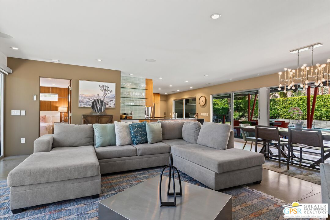 1349 Sagebrush Road Palm Springs, CA 92264 - Photo 14 of 61 a living room with furniture and a large window