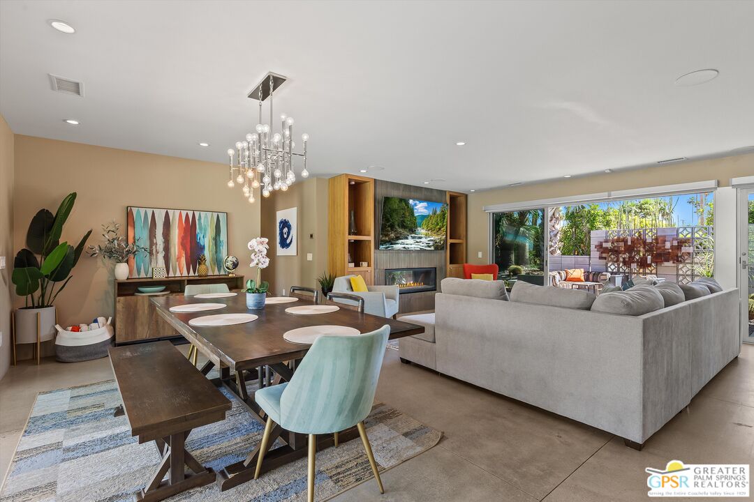1349 Sagebrush Road Palm Springs, CA 92264 - Photo 16 of 61 a living room with furniture and a chandelier