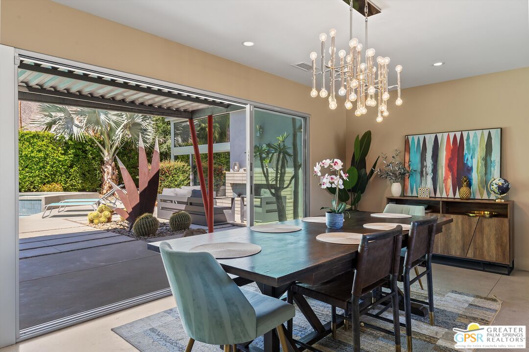 1349 Sagebrush Road Palm Springs, CA 92264 - Photo 18 of 61 a view of a dining room with furniture window and outside view