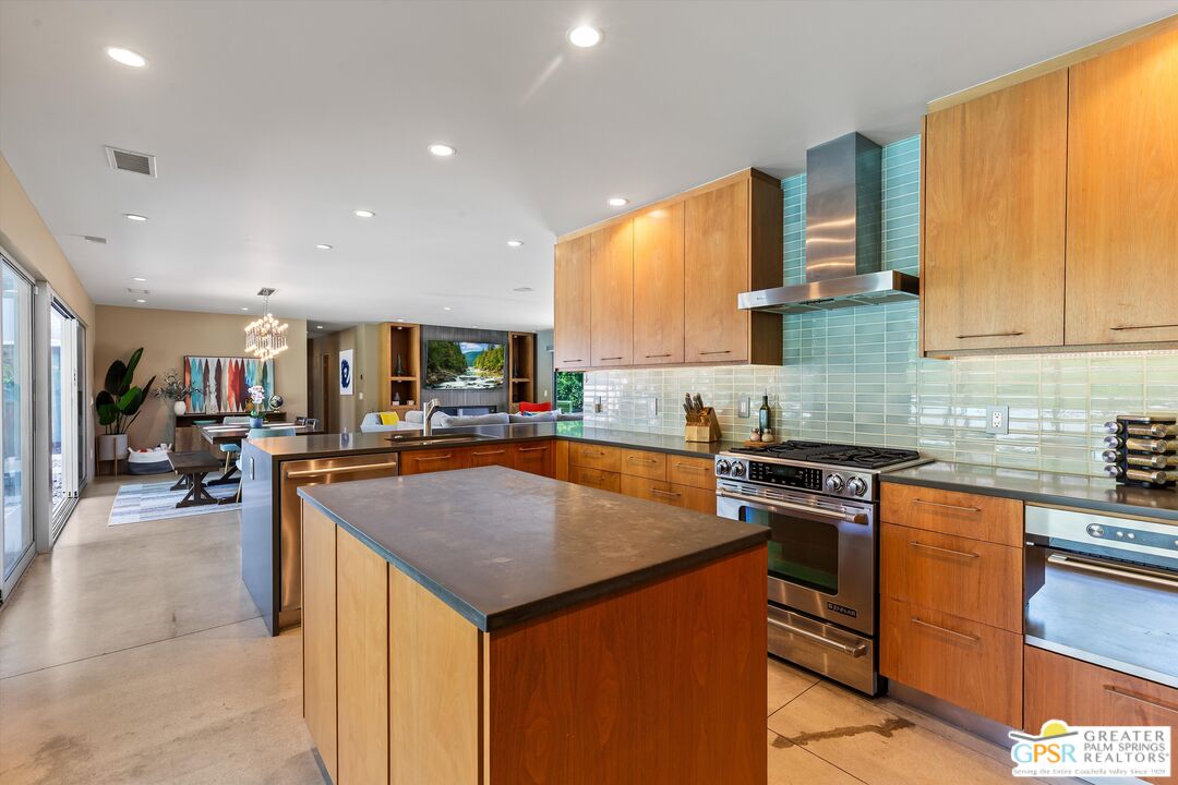 1349 Sagebrush Road Palm Springs, CA 92264 - Photo 22 of 61 a kitchen with stainless steel appliances granite countertop a sink a stove and a refrigerator