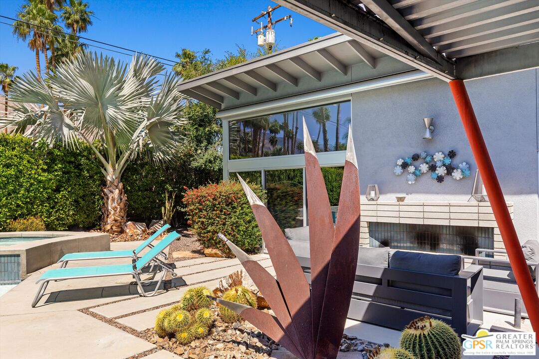 1349 Sagebrush Road Palm Springs, CA 92264 - Photo 25 of 61 a view of balcony with two chairs and wooden fence