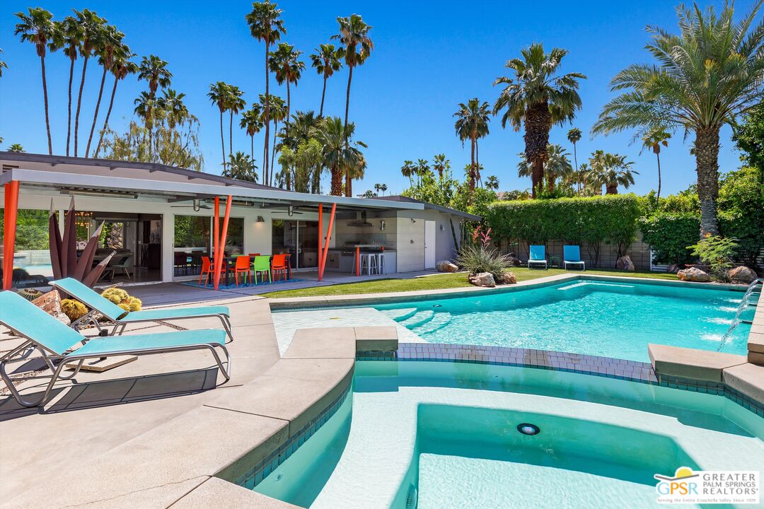 1349 Sagebrush Road Palm Springs, CA 92264 - Photo 32 of 61 a view of swimming pool with lawn chairs and a big yard