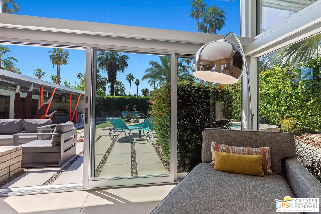 1349 Sagebrush Road Palm Springs, CA 92264 - Photo 37 of 61 a living room with large windows