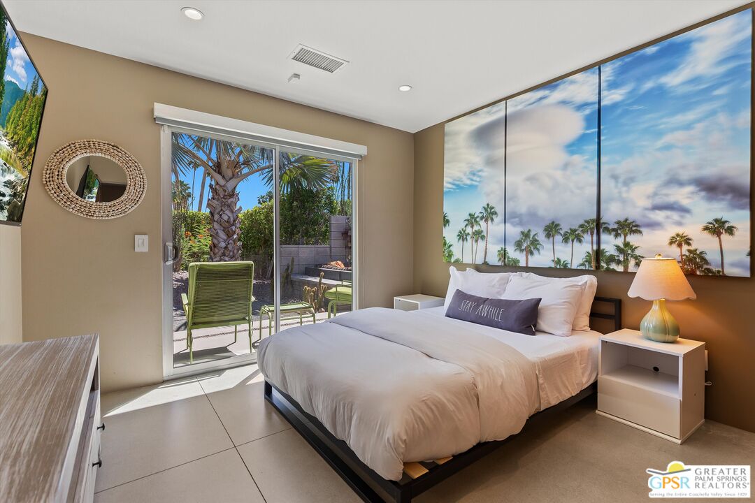 1349 Sagebrush Road Palm Springs, CA 92264 - Photo 40 of 61 a bedroom with a bed and a large window