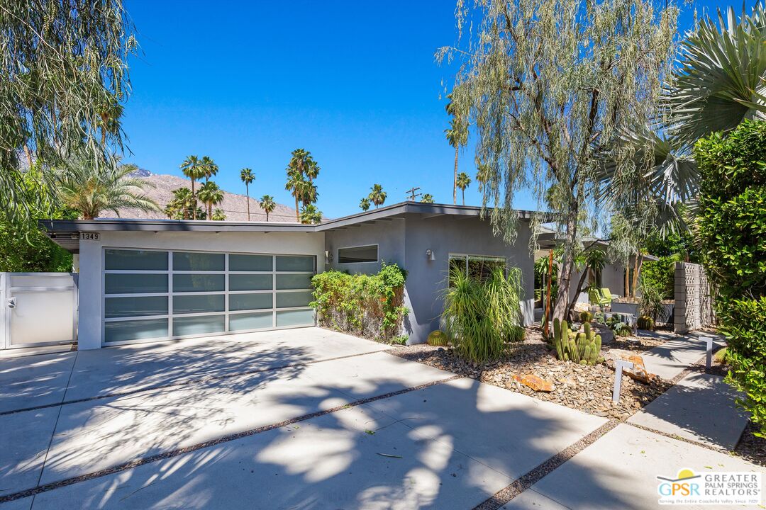 1349 Sagebrush Road Palm Springs, CA 92264 - Photo 7 of 61 a view of a house with potted plants and large trees