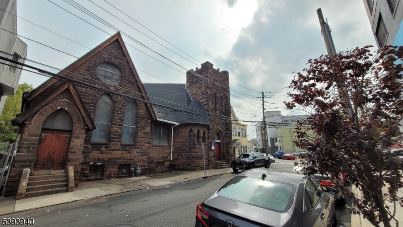 221 Spring Street Paterson, NJ 07503 - Photo 15 of 30 a view of car parked in front of building