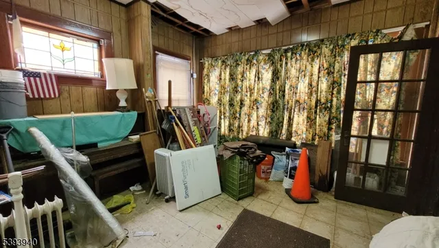 a view of a room with furniture and a window