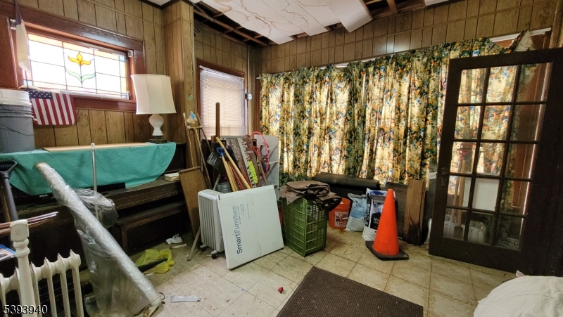 221 Spring Street Paterson, NJ 07503 - Photo 20 of 30 a view of a room with furniture and a window