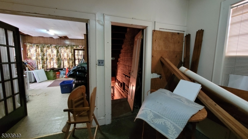 221 Spring Street Paterson, NJ 07503 - Photo 23 of 30 a living room with furniture fireplace and a large window