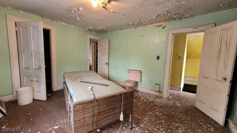 221 Spring Street Paterson, NJ 07503 - Photo 27 of 30 a bathroom with a sink a toilet and shower