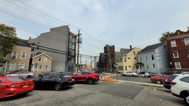 221 Spring Street Paterson, NJ 07503 - Photo 30 of 30 a view of cars parked in front of a house