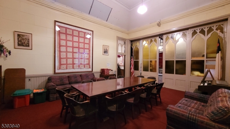 221 Spring Street Paterson, NJ 07503 - Photo 4 of 30 a living room with furniture and a large window