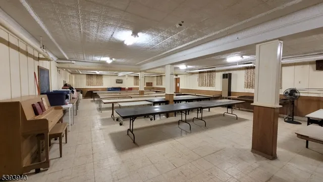 a room with lots of furniture and a wooden floor