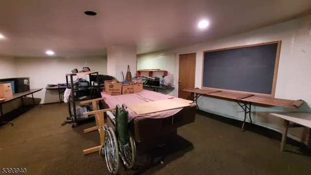 a room with gym equipment and a flat screen tv