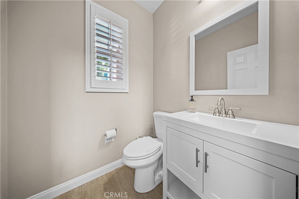4 Potters Bend Ladera Ranch, CA 92694 - Photo 12 of 31 a bathroom with a toilet sink and mirror