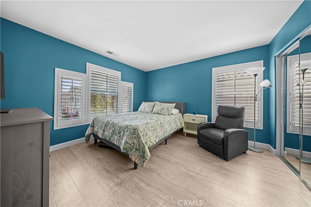 4 Potters Bend Ladera Ranch, CA 92694 - Photo 14 of 31 a bedroom with a bed and a couch next to a window