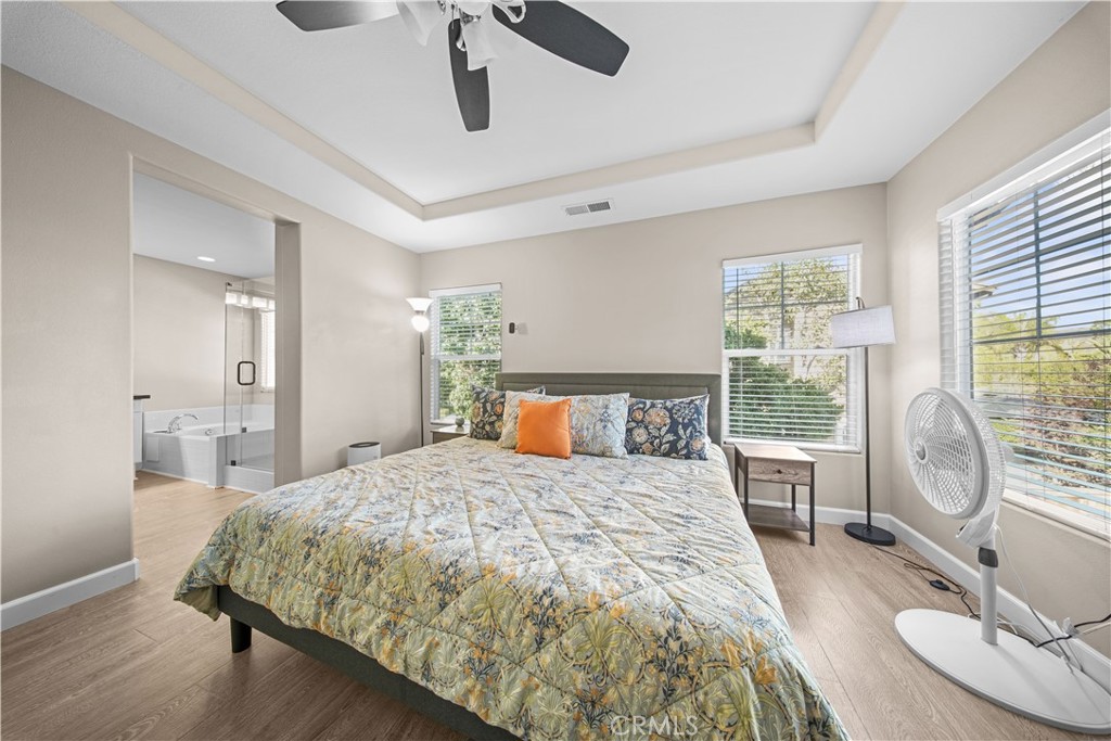 4 Potters Bend Ladera Ranch, CA 92694 - Photo 17 of 31 a bedroom with a large bed and a chandelier