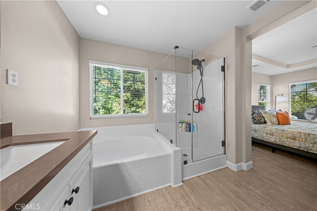 4 Potters Bend Ladera Ranch, CA 92694 - Photo 19 of 31 a bathroom with a tub shower and sink