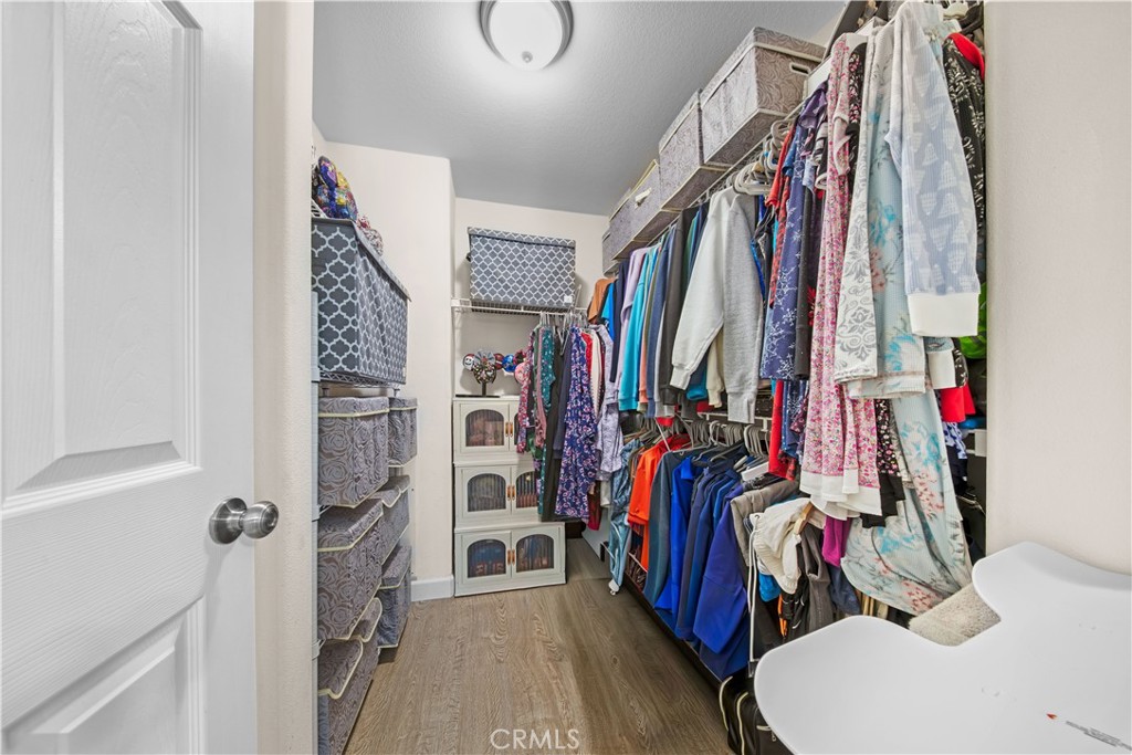 4 Potters Bend Ladera Ranch, CA 92694 - Photo 22 of 31 a view of walk in closet with clothes