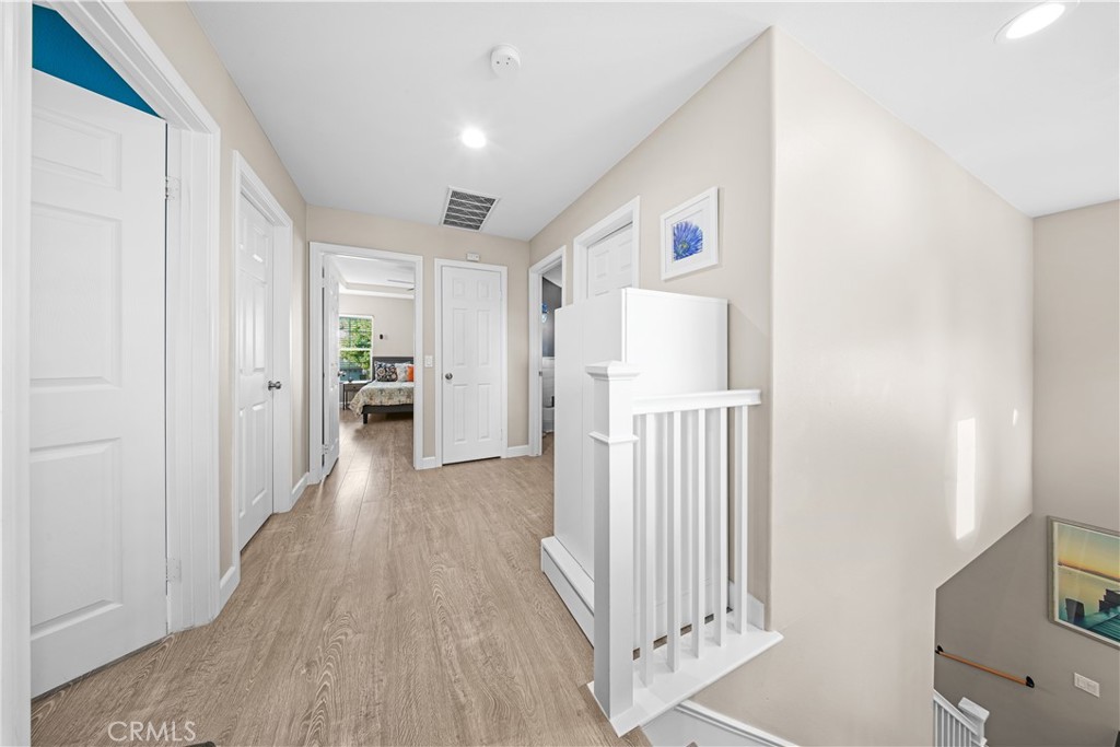 4 Potters Bend Ladera Ranch, CA 92694 - Photo 23 of 31 a view of a hallway with wooden floor