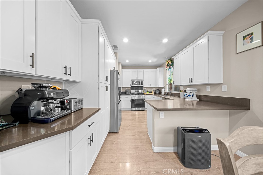 4 Potters Bend Ladera Ranch, CA 92694 - Photo 5 of 31 a kitchen with counter top space cabinets and appliances