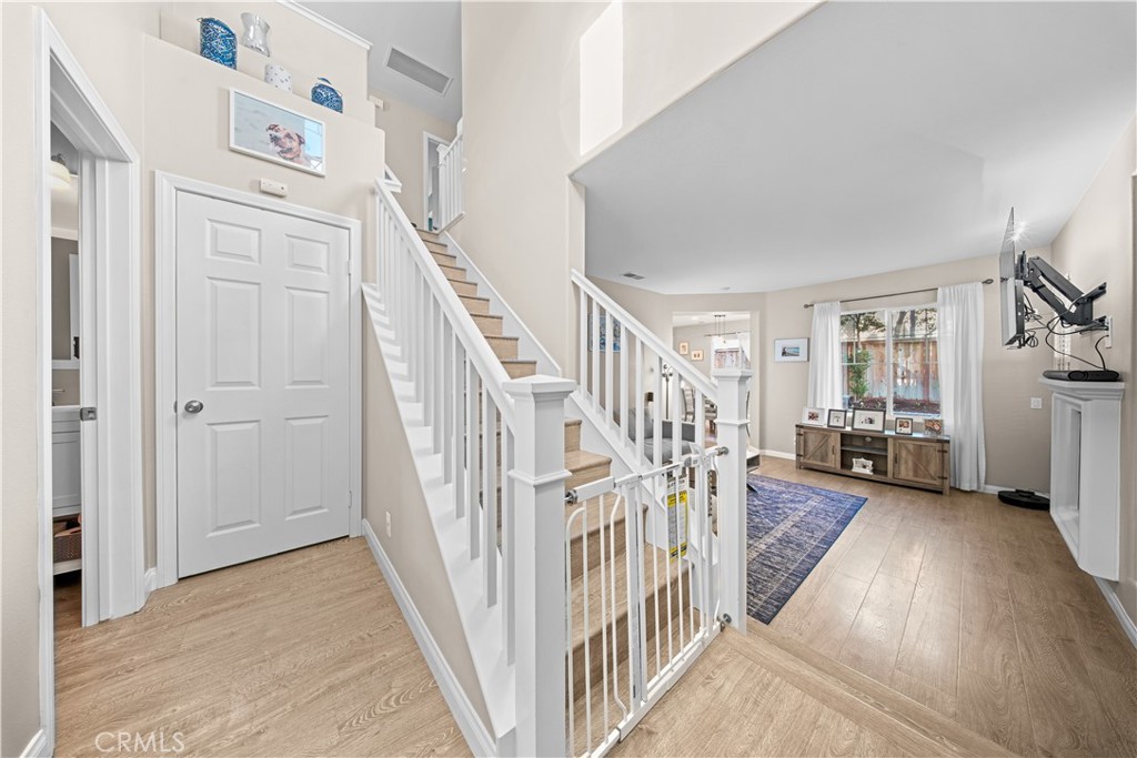 4 Potters Bend Ladera Ranch, CA 92694 - Photo 8 of 31 a view of a livingroom with wooden floor and stairs