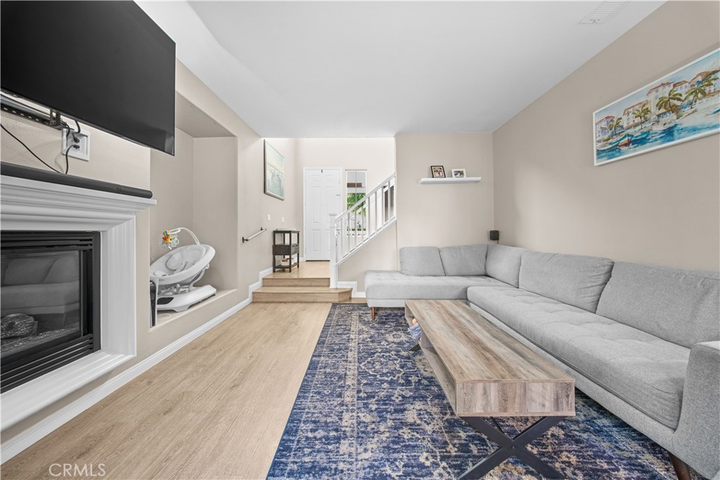 4 Potters Bend Ladera Ranch, CA 92694 - Photo 9 of 31 a living room with furniture and a fireplace