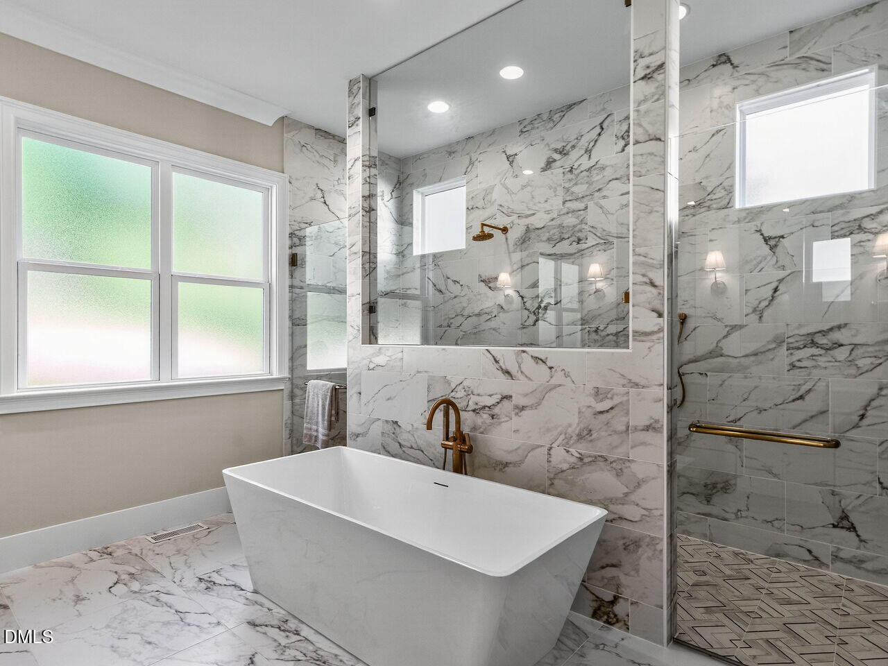 1309 Montvale Ridge Drive Cary, NC 27519 - Photo 15 of 24 a bathroom with a bathtub and shower