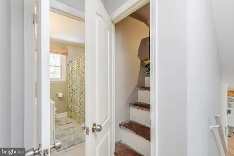 a view of a bathroom from a hallway