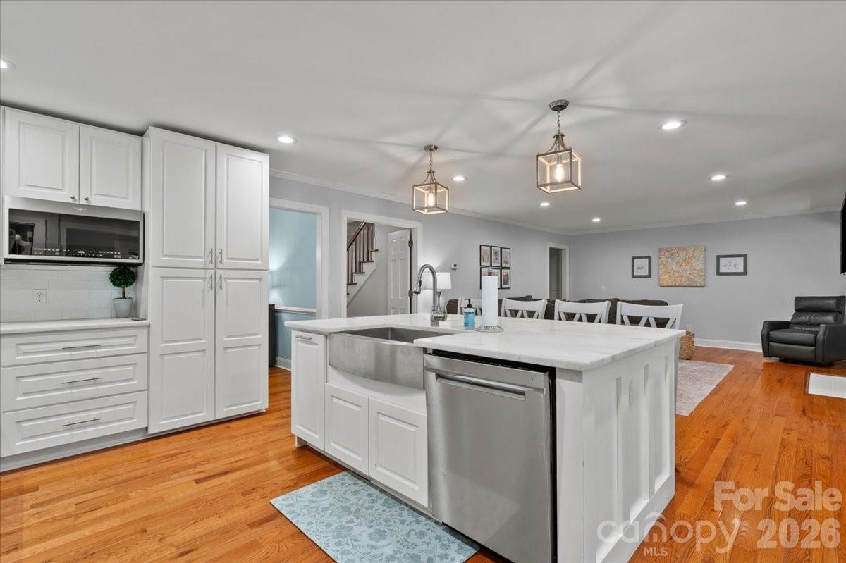 209 Fairway Road Cheraw, SC 29520 - Photo 12 of 48 a kitchen with stainless steel appliances granite countertop a sink and cabinets