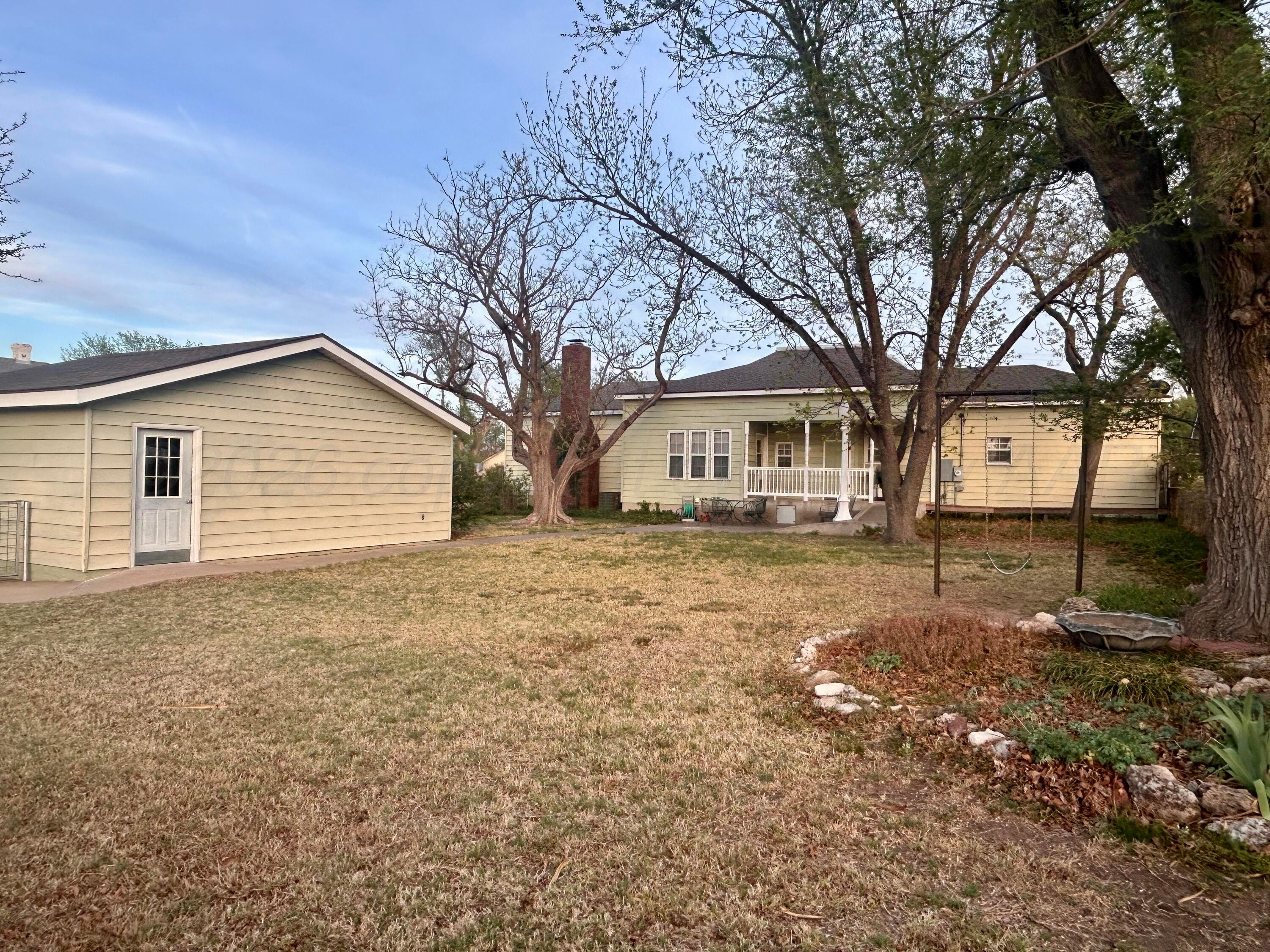 216 North 7th Street Canadian, TX 79014 - Photo 23 of 35 a house that has a tree in front of it