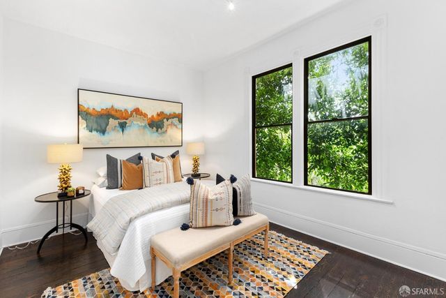 a bedroom with furniture and a window