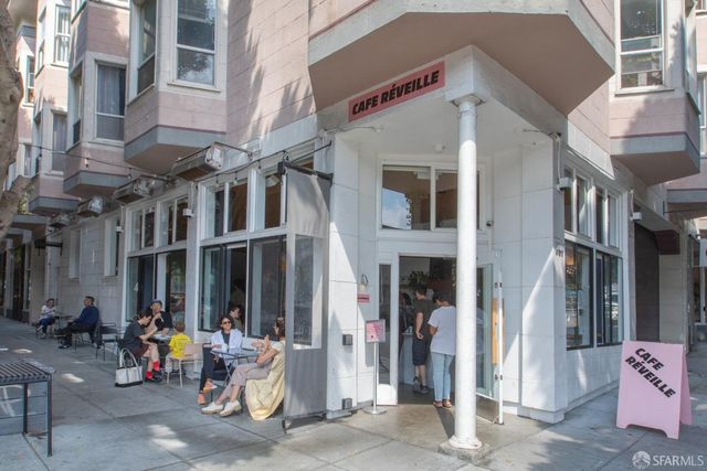 a view of a building with sitting area