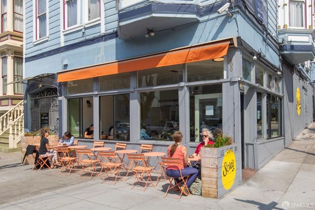 a view of a building with sitting area