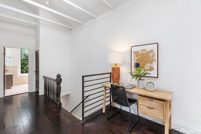 a workspace with furniture and wooden floor